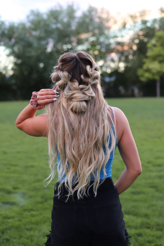 girl with braided half up hairstyle